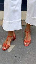 A single Allegra vintage sandal, showcasing its elegant golden finish.