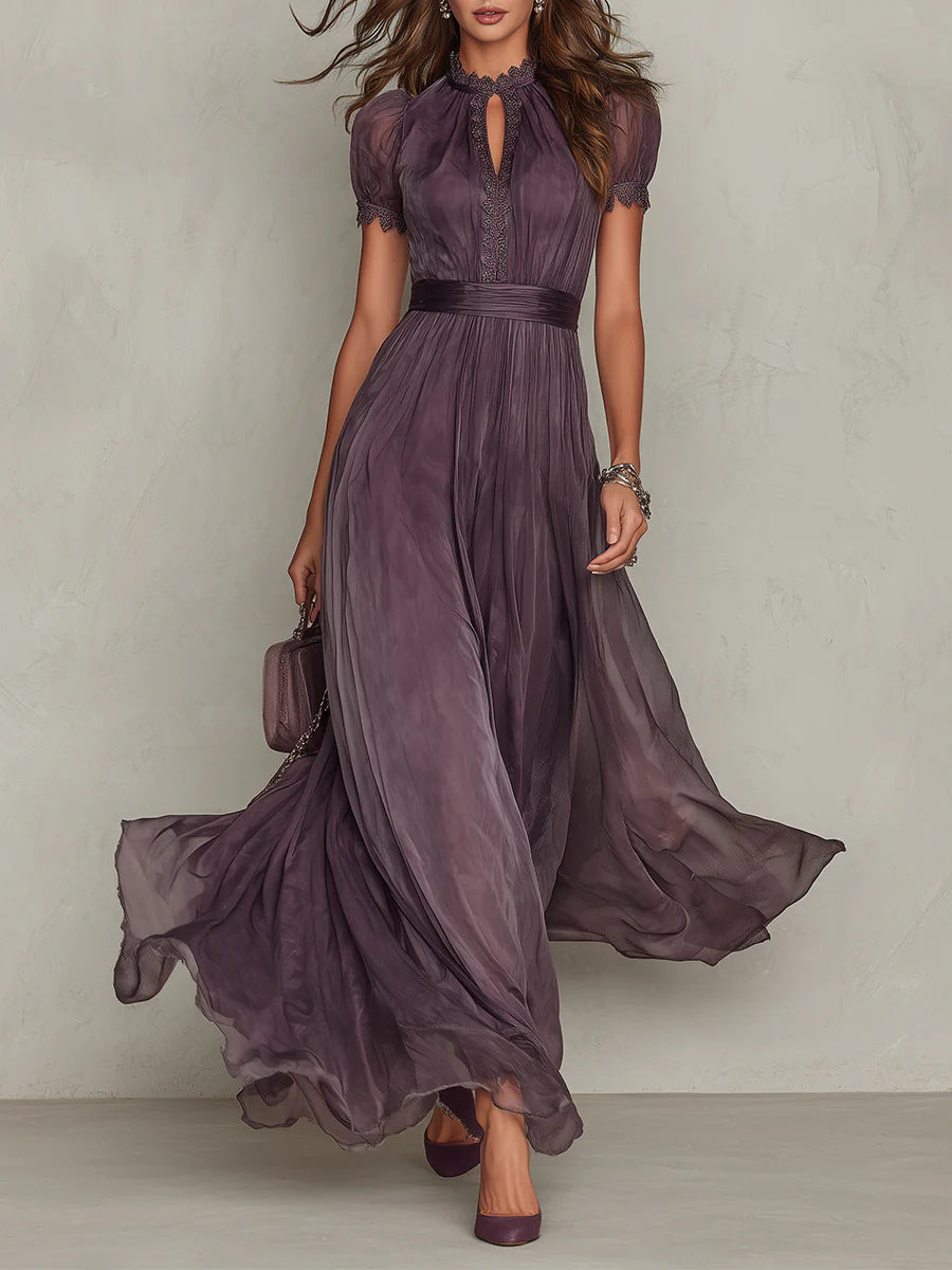 Front view of a woman wearing the purple chiffon lace maxi dress, showcasing the keyhole neckline and flowing skirt.