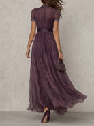 Close-up detail of the keyhole neckline and subtle lace accents on the bodice of the chiffon maxi dress.