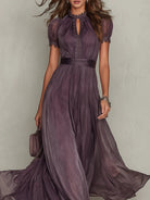 Back view of the purple flowing chiffon lace maxi dress, showing the drape of the fabric and the full length.