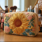 Front view of the Anouk quilted cosmetic bag in a gentle sun print, showcasing its texture and elegant design.