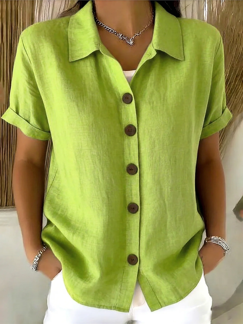 Lifestyle shot of the orange Daphne shirt, perfect for warm weather and everyday comfort.