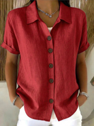 Front view of the Daphne relaxed button-front shirt in white, styled for a casual day out.