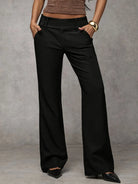 Front view of Indira relaxed fit trousers in black, showcasing the high waist and straight leg design.