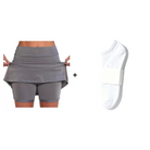 A detailed view of the integrated shorts inside the orange active skort, preventing chafing.