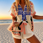 Front view of the Renée artful printed shirt, showcasing its relaxed ivory weave and unique botanical and graphic patterns in cobalt, coral, and black.