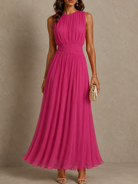 Frida ruched waist maxi dress displayed on a hanger, showcasing its full length and soft, airy chiffon material.