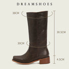 Elara classic Western boots in dark brown, showcased in an outdoor setting, complementing an autumn-inspired outfit.