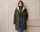 Image focusing on the Elara parka's pocket design, indicating practicality and secure storage.