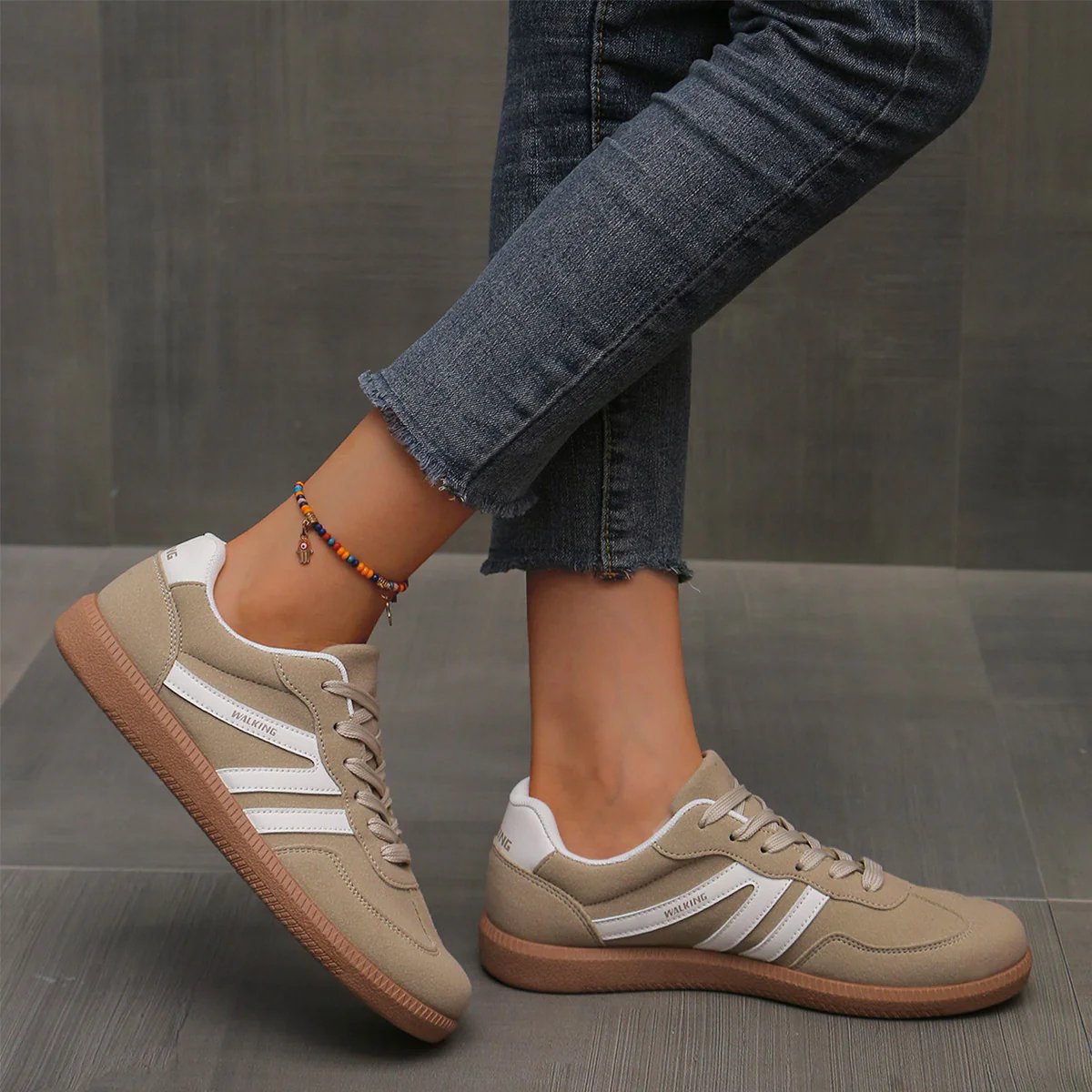 A single wine red Elara orthopaedic cushioned trainer, showcasing its rich color and material.