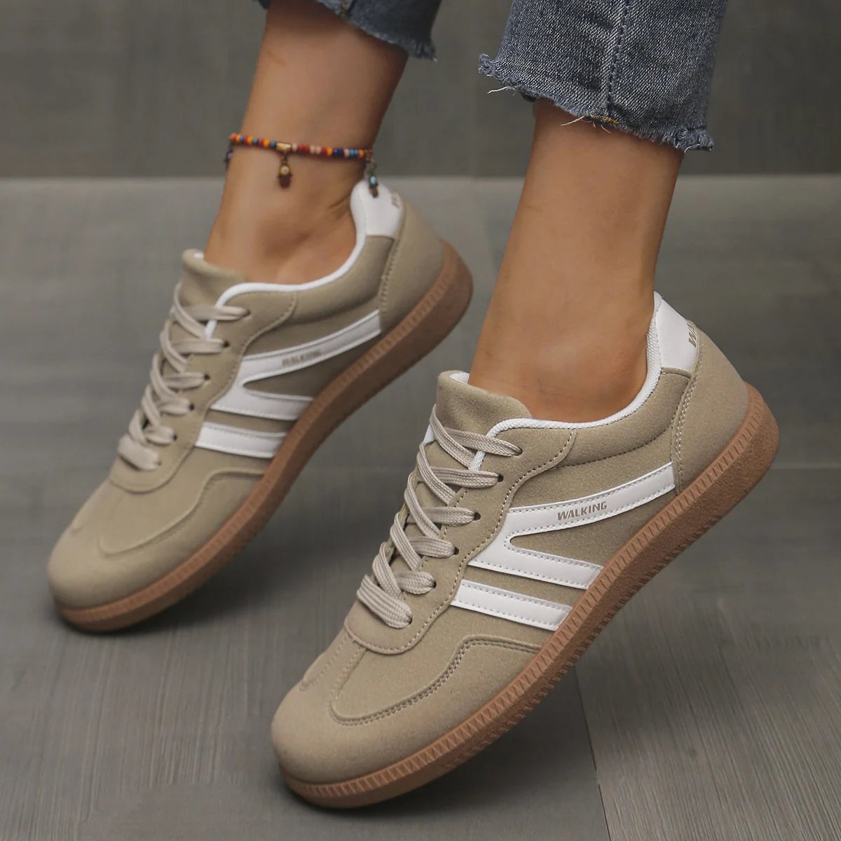 Side profile of a khaki Elara orthopaedic cushioned trainer, emphasizing the layered sole construction.