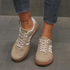 Overhead view of a pair of brown Elara orthopaedic cushioned trainers, highlighting the earthy tone.