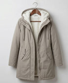 Another angle of the Elara waterproof parka, emphasizing its sleek silhouette and protective features.