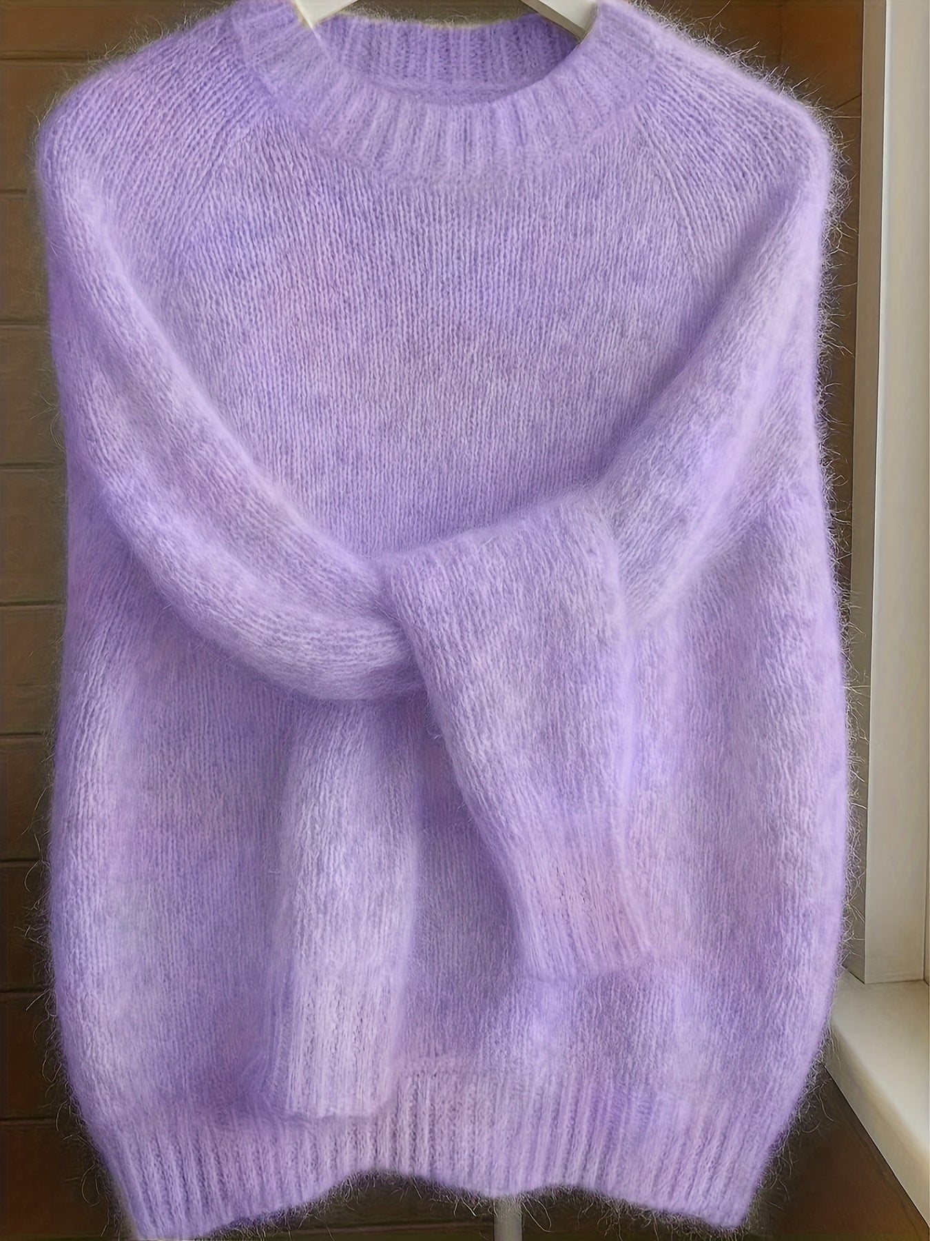 Close-up of the luxurious cashmere-blend knit texture on the Elara sweater, highlighting its fine quality.