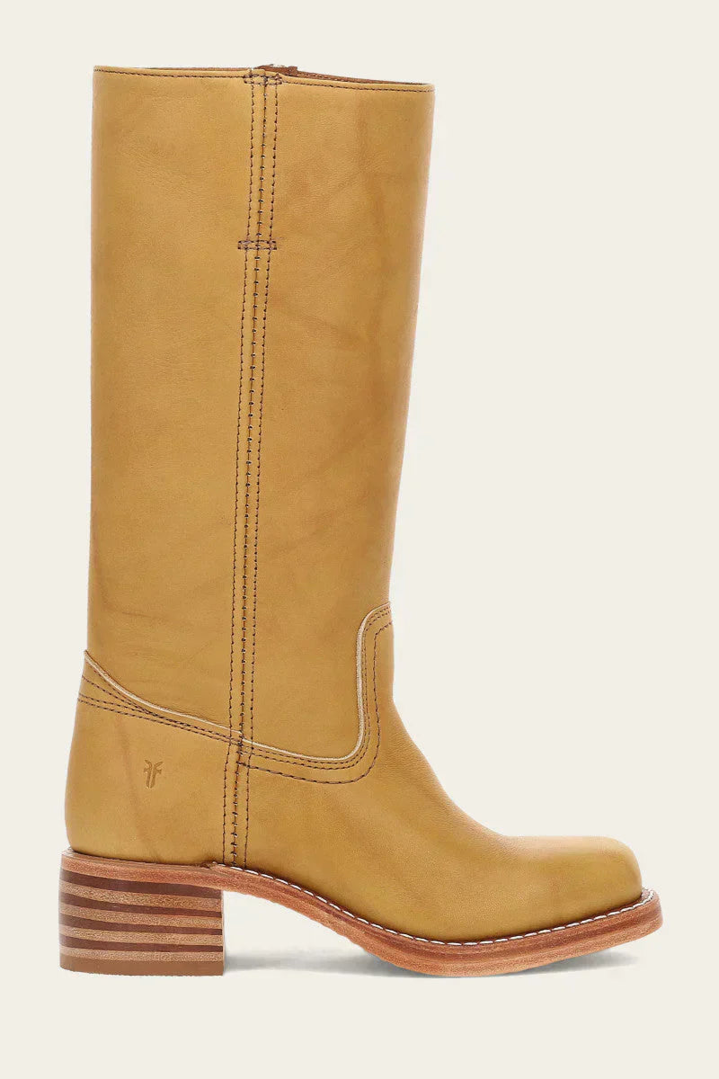 Elara classic Western boots in a vibrant yellow, styled casually with denim jeans, capturing a dynamic lifestyle shot.