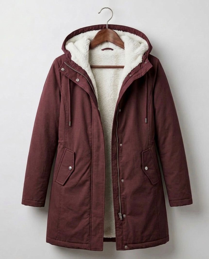 Detail shot of the soft, high-loft fleece lining inside the Elara parka, promising warmth and comfort.