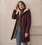 View of the Elara parka's full-length zipper with the button-down storm flap for complete wind protection.