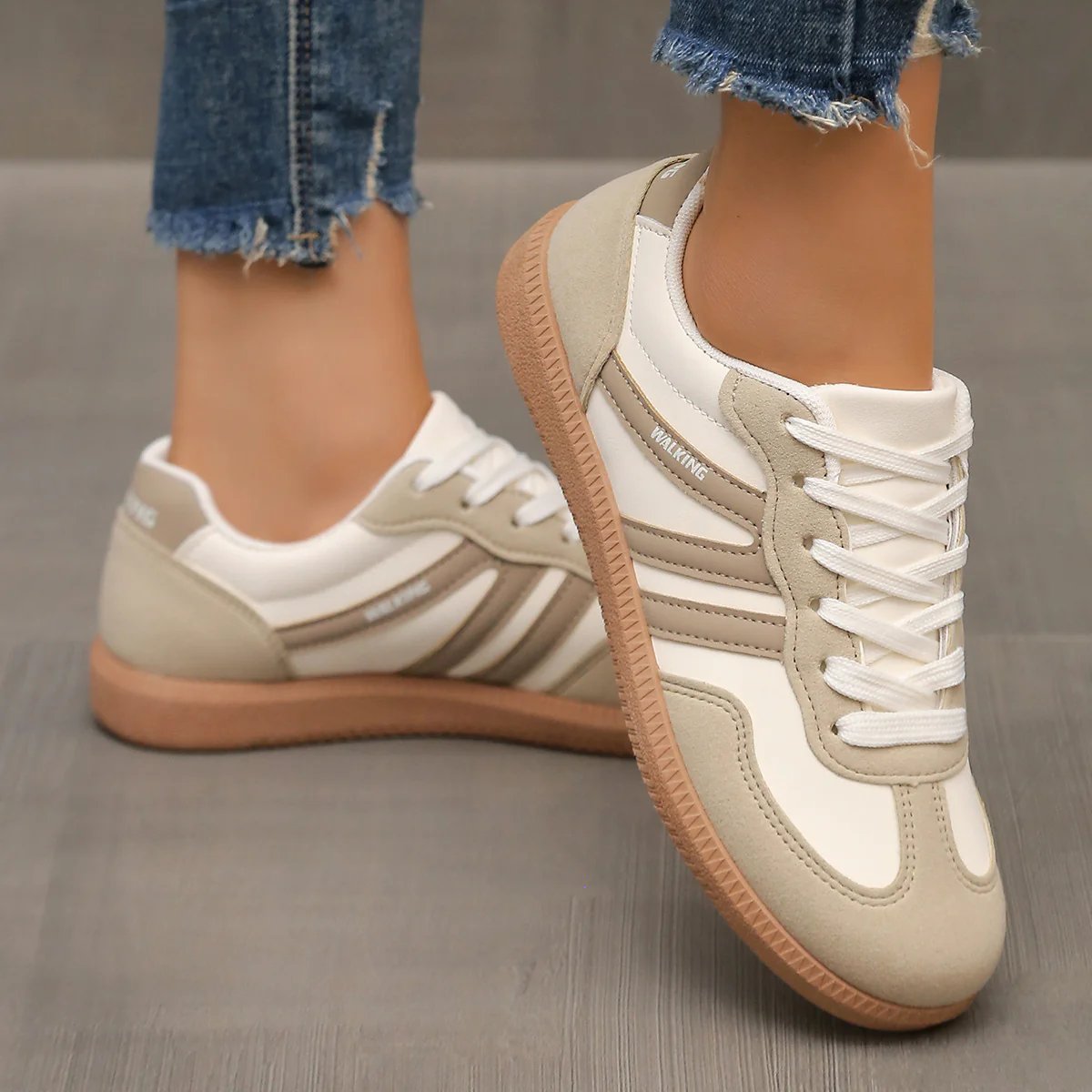 Back view of the off-white Elara orthopaedic cushioned trainers, showing the heel support and branding.