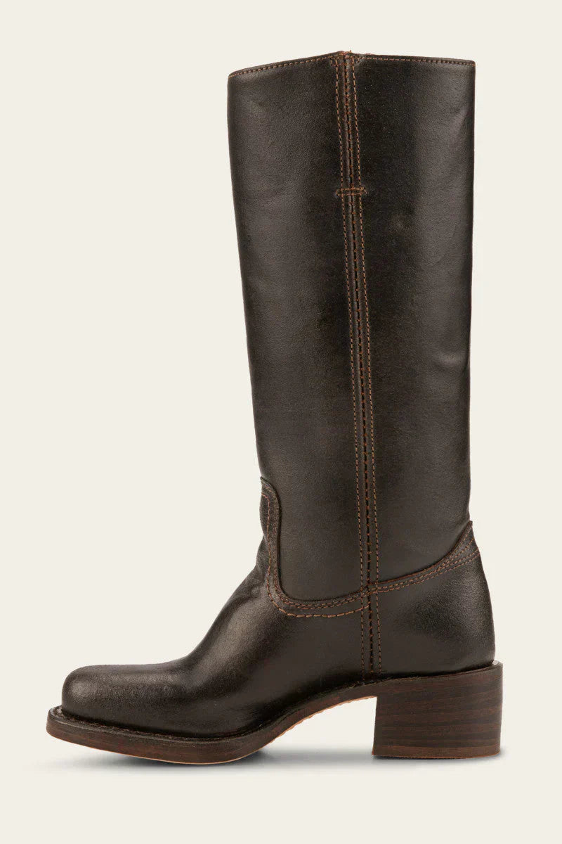 Elara classic Western boots in black on a model's feet, paired with a flowing dress, demonstrating versatile styling.