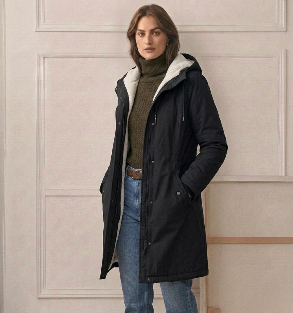 Open view of the Elara parka, revealing the contrast between the waterproof shell and the plush interior.