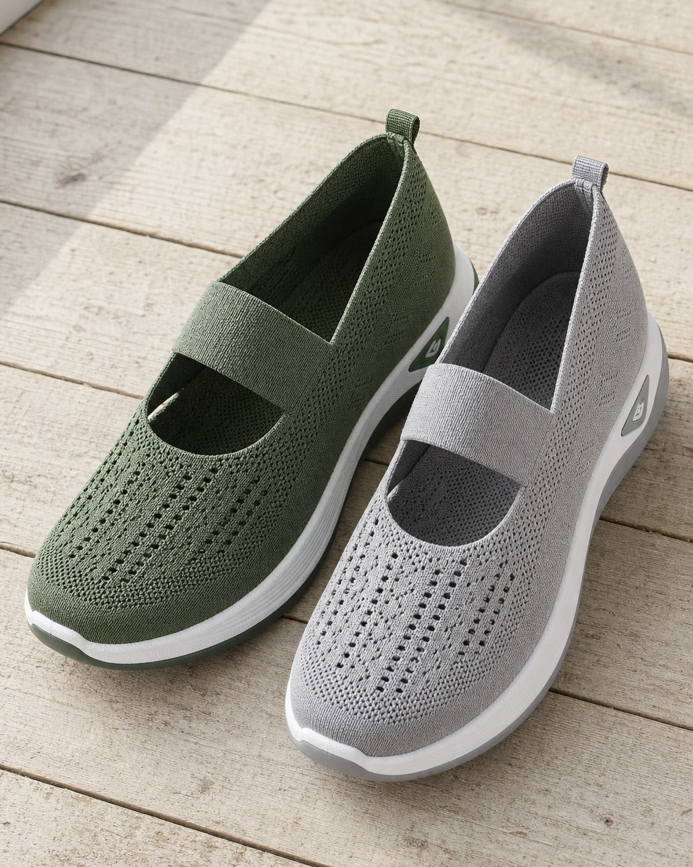 Green and grey Carry knit slip-ons side by side on a timber floor