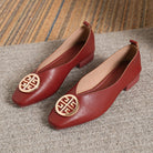 Beige square-toe flats styled with tailored trousers, demonstrating their versatility for business casual.