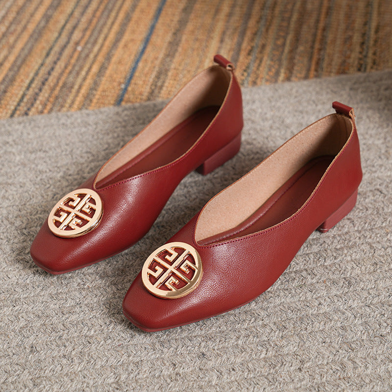 Beige square-toe flats styled with tailored trousers, demonstrating their versatility for business casual.