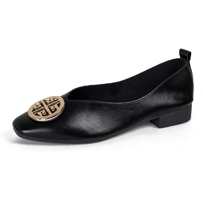 Detail shot of the microfiber texture and faux-leather insole of the comfortable square-toe flats.