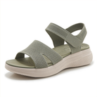 Three pairs of the walking sandals in different colors (beige, black, blue) arranged neatly, showcasing color variety.