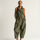 Lifestyle image of the khaki sleeveless jumpsuit, demonstrating its ease of movement and relaxed fit for various activities.