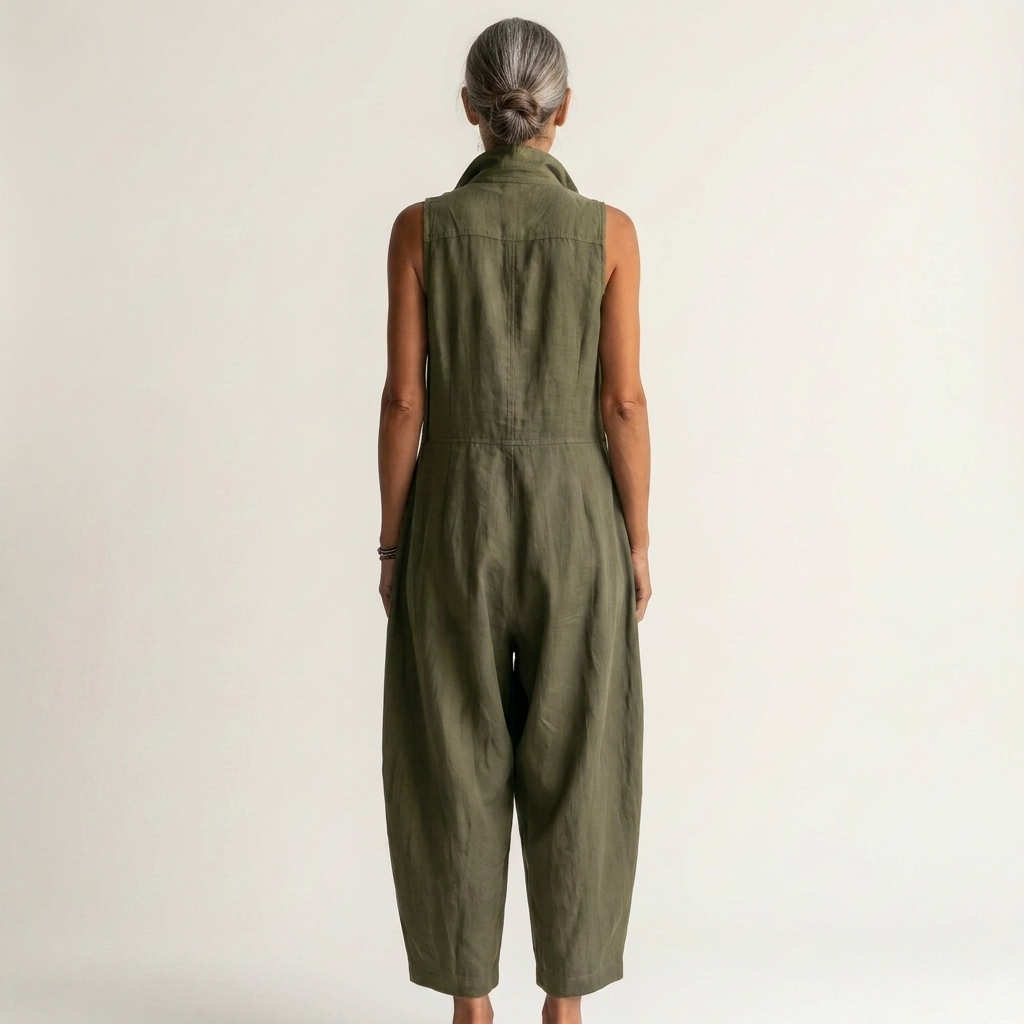 Close-up of the lightweight cotton-blend fabric texture on the wide-leg sleeveless jumpsuit, in a soft khaki shade.