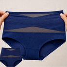 Shaping underwear in blue, folded neatly on a light surface, ready for comfortable wear.