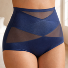 Detail shot of the crisscross X-bands on the tummy of the shaping underwear for targeted support.