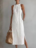Front view of the Adara elegant midi dress in white, showcasing its loose fit and Mao collar.