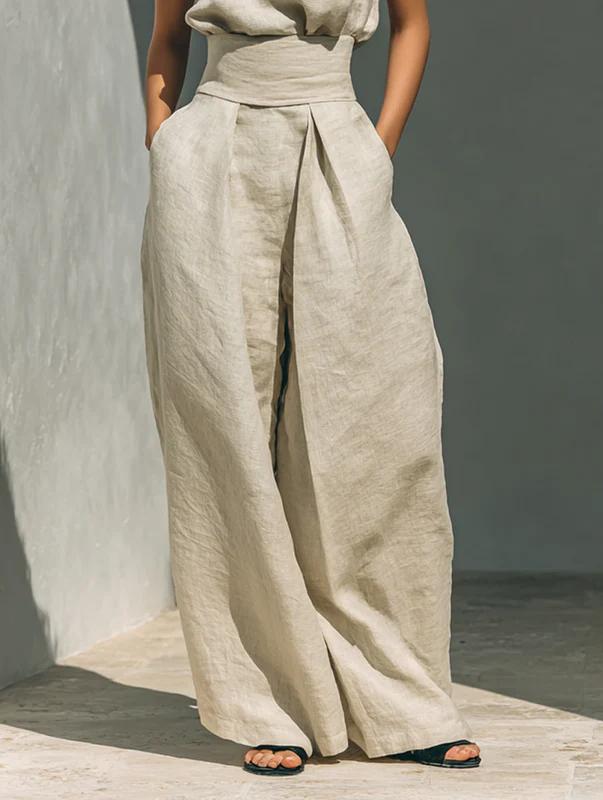 Back view of the relaxed fit cotton trousers in olive green, showing the smooth rear and comfortable drape.
