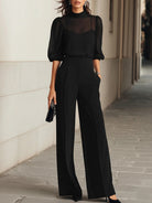 Front view of the Indira elegant three-piece set, showcasing the sheer black chiffon top over the camisole and wide-leg pants.
