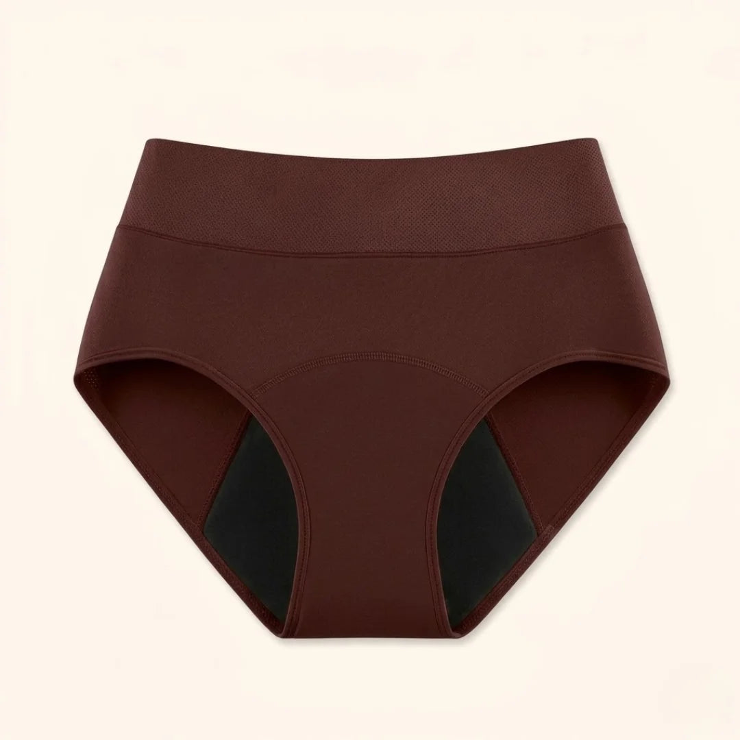 Side profile of a model wearing beige Inez leak-proof protective underwear, demonstrating its seamless fit under clothing.