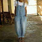 Detailed shot of the soft denim-look fabric texture on the Juniper overalls, emphasizing its comfortable, cotton-like feel.