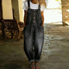Back view of the Juniper wide-leg denim overalls, showing the overall design and comfortable fit in a casual setting.