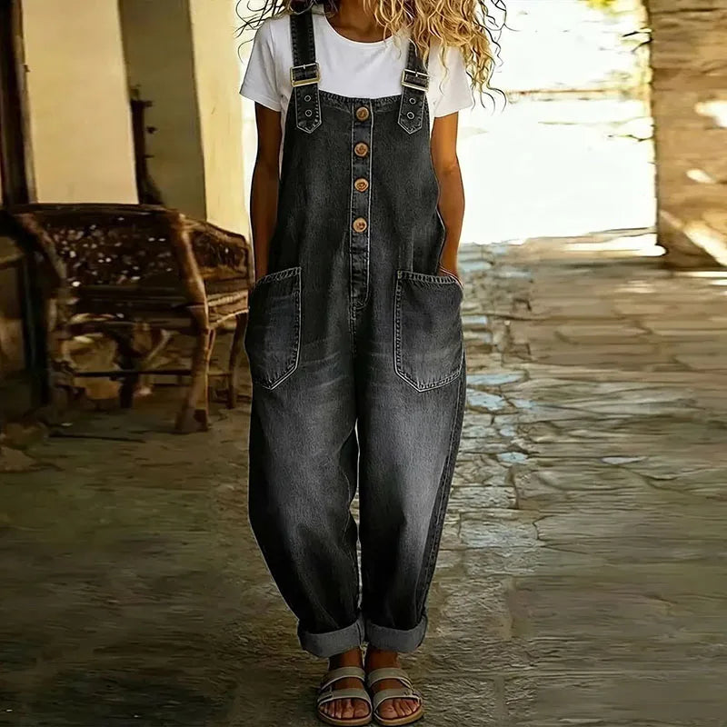 Back view of the Juniper wide-leg denim overalls, showing the overall design and comfortable fit in a casual setting.