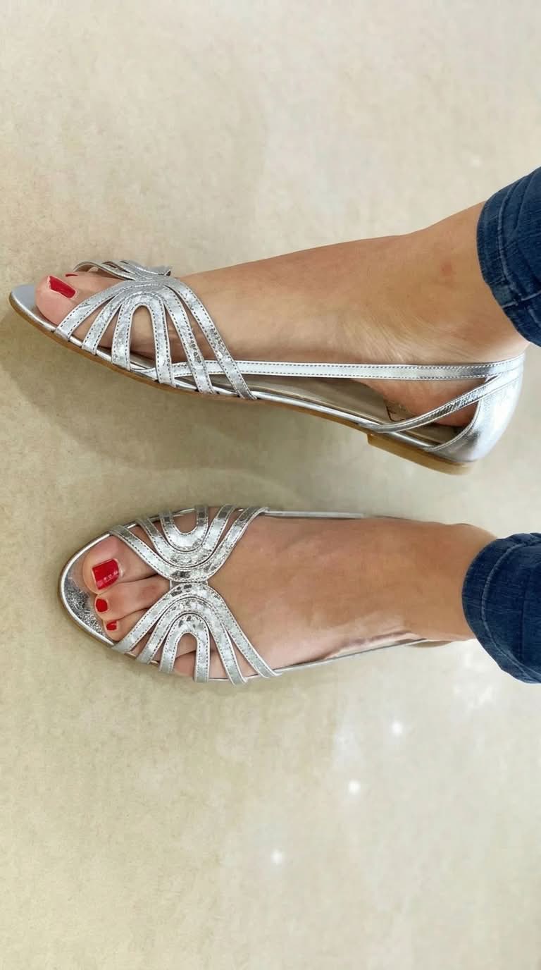 Close-up of the golden detail on a Kaelen vintage sandal, emphasizing the luminous finish and craftsmanship.