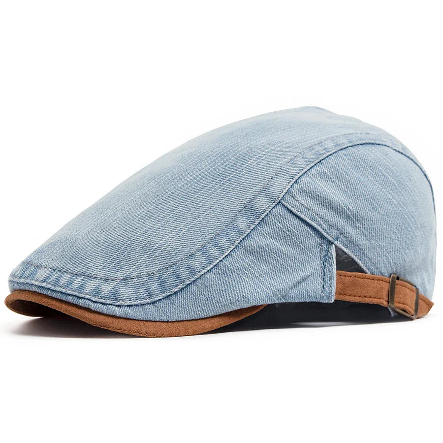 Side profile of the Kian classic denim flat cap, highlighting the smooth curve and premium denim texture.