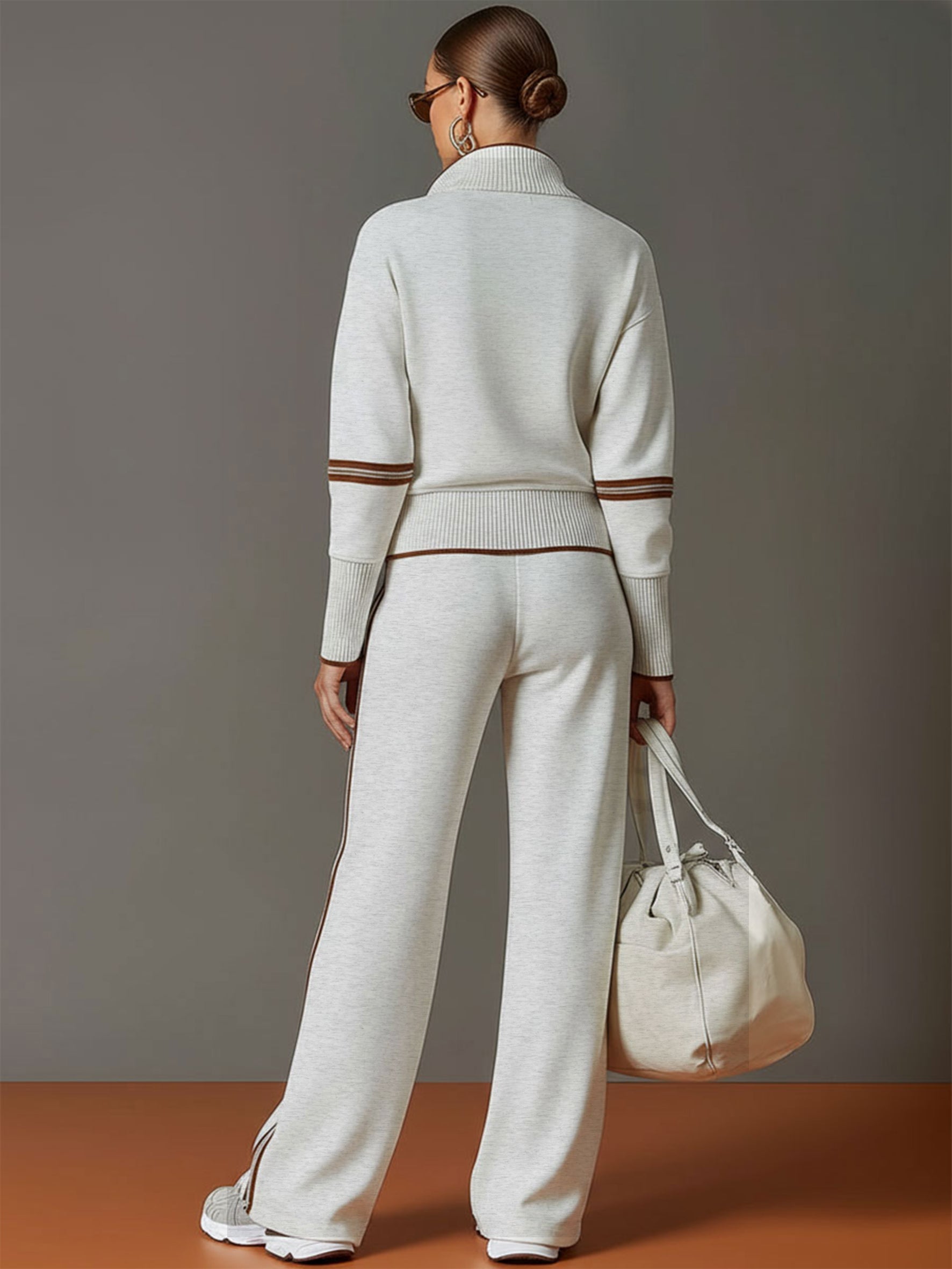 Woman posing in a studio setting, emphasizing the versatile styling of the wide-leg pants.