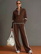 Lifestyle shot of a woman walking outdoors, illustrating the graceful movement of the wide-leg pants.
