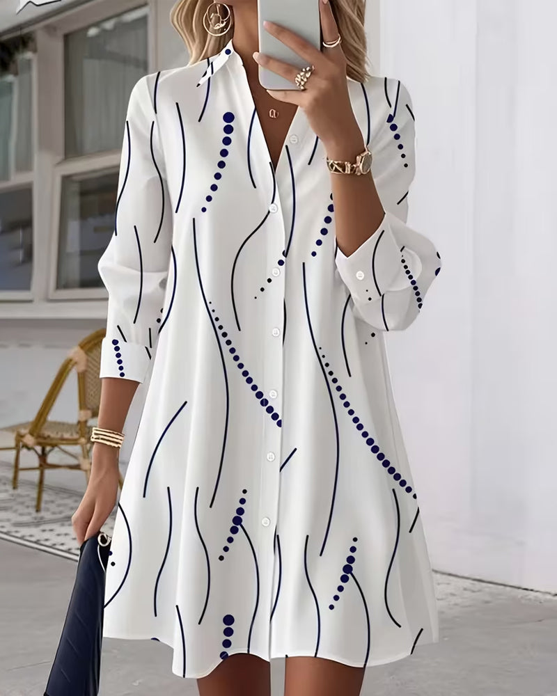 Back view of the Kora A-line dress, showing the full length and the subtle drape of the wavy stripe garment.
