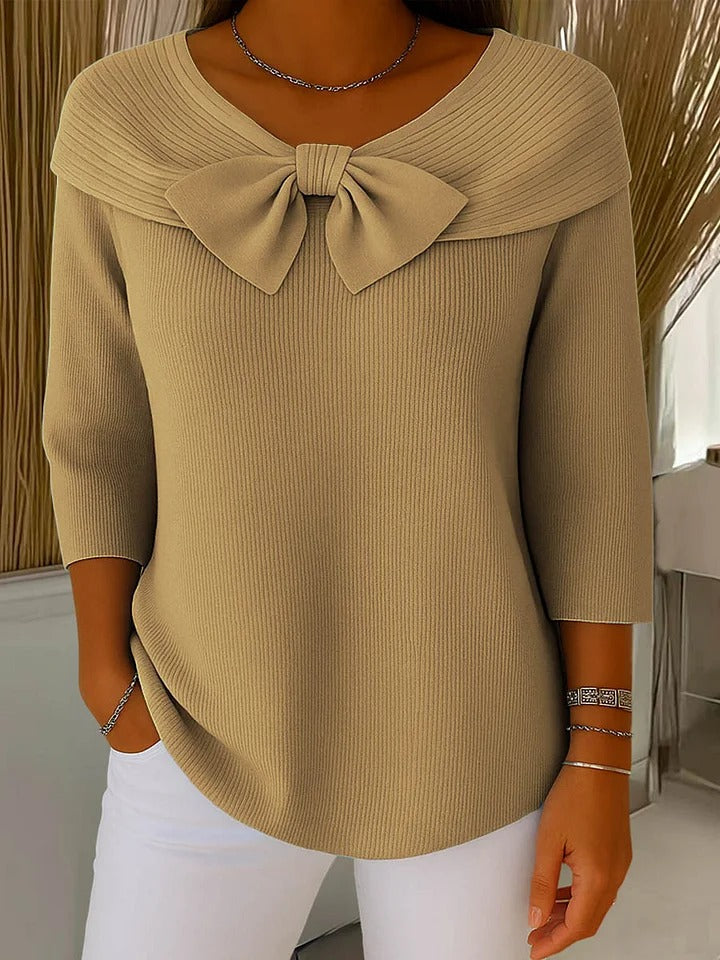 Close-up detail of the fine knit texture on the Lana tunic, showing the quality of the garment.