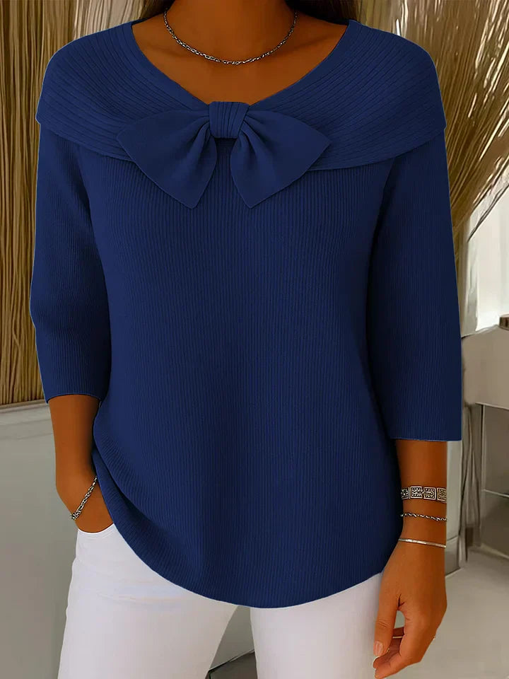 Model wearing the Lana elegant knit tunic in a khaki shade, styled casually for a relaxed look.