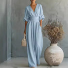Front view of a black flowing jumpsuit, highlighting the flattering silhouette and comfortable drape.