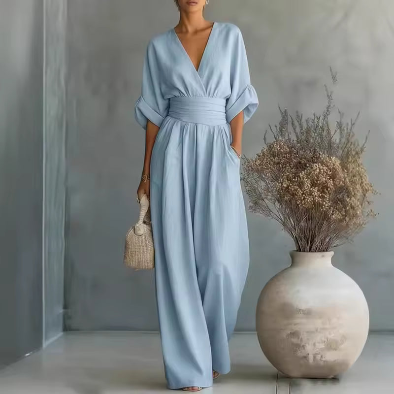 Front view of a black flowing jumpsuit, highlighting the flattering silhouette and comfortable drape.