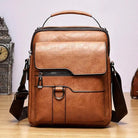 Milo modern shoulder bag in black, with the flap slightly open, revealing the practical and spacious interior layout.